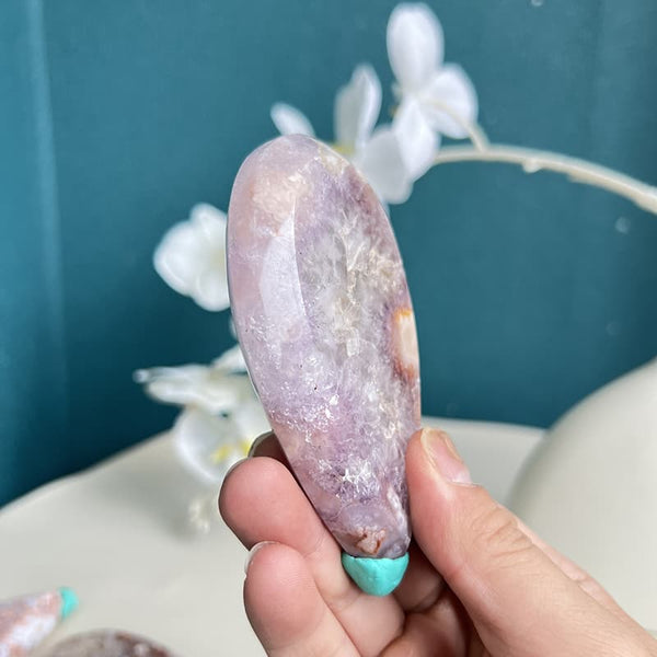 Side view of handcrafted pink amethyst whale crystal carving