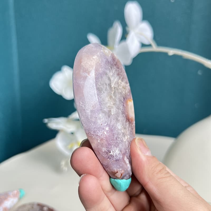 Side view of handcrafted pink amethyst whale crystal carving