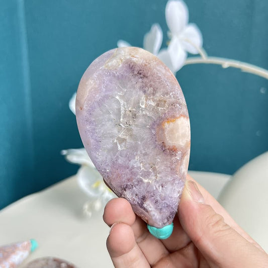 Natural pink amethyst whale crystal carving with purple crystalline formations