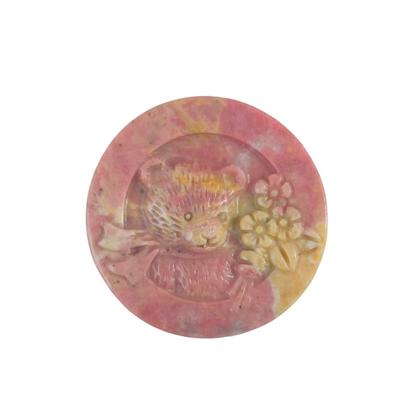 Natural texture and patterns in pink rhodonite bear carved crystal