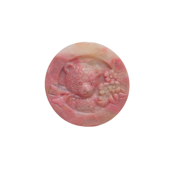 Pink rhodonite bear figurine with distinctive black manganese inclusions