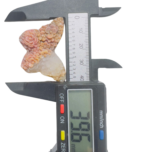 Size measurement of rhodonite butterfly crystal healing stone