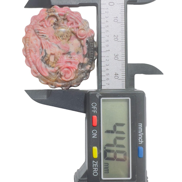 Pink rhodonite carved crystal measurement showing diameter size