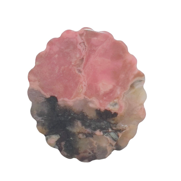 Side profile of pink rhodonite carved crystal showing thickness