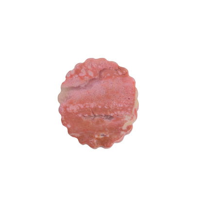 Pink rhodonite carved crystal displayed with healing stones