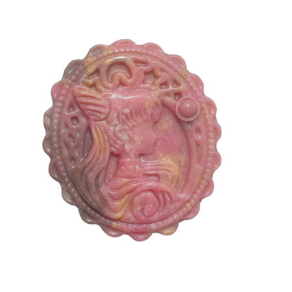 Pink rhodonite crystal carved medallion reverse side showing natural patterns