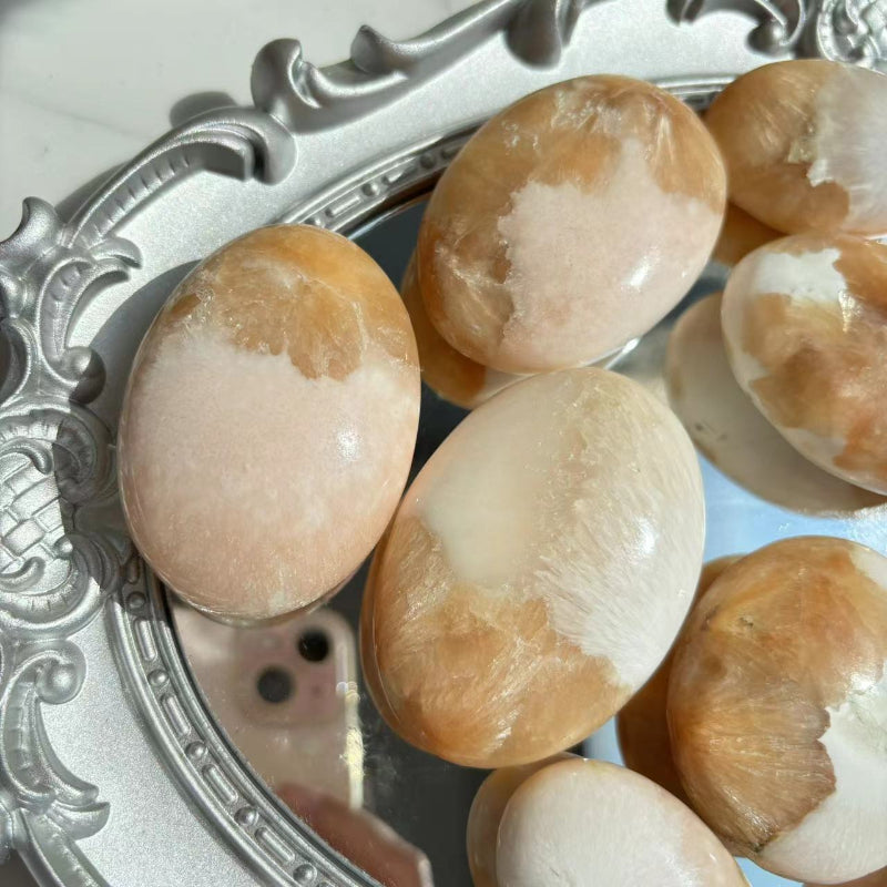  Crystal Healer Using Pink Scolecite Palm Stone During Treatment