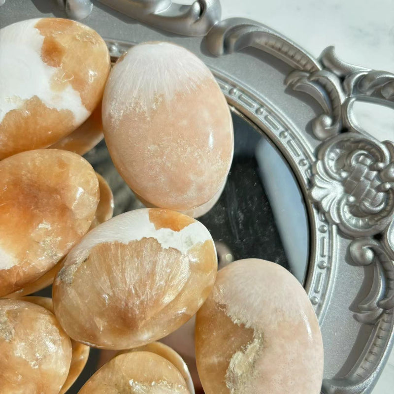 Smooth Polished Surface of Pink Scolecite Palm Stone