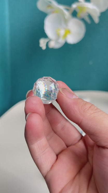 Collection of premium Clear Quartz carved crystal spheres displaying varied internal characteristics