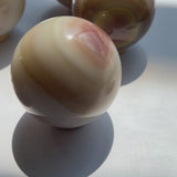 Polished Agate Crystal Sphere Showing Color Variations