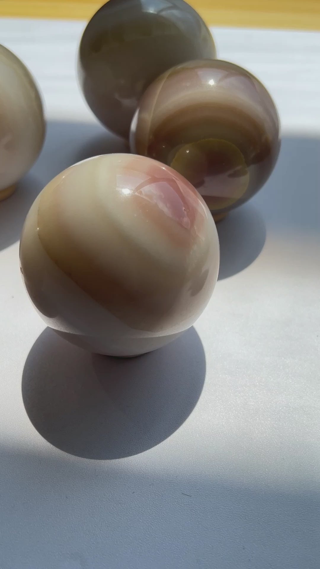 Polished Agate Crystal Sphere Showing Color Variations