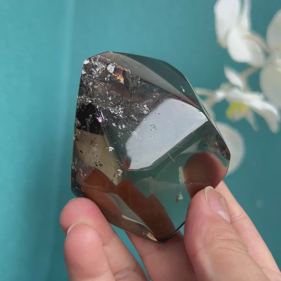 Polished surface of smoky quartz free form crystal