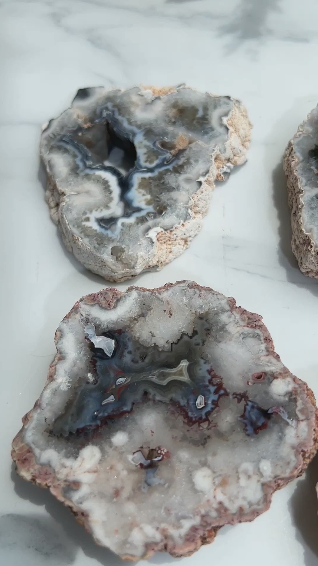 Collection of wholesale agate slabs showing variety of colors and patterns"