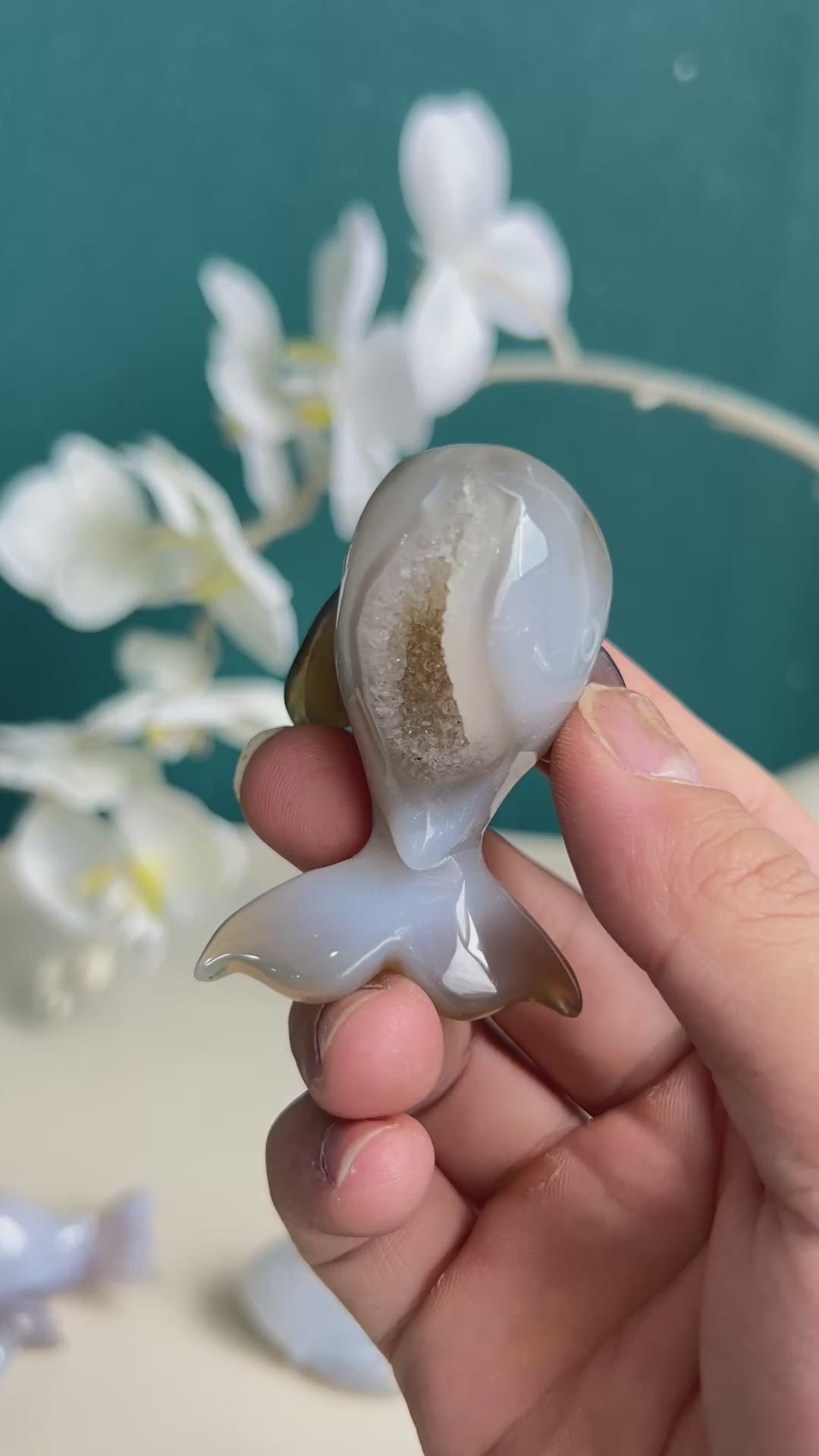 White agate dolphin crystal representing spiritual connection and tranquility