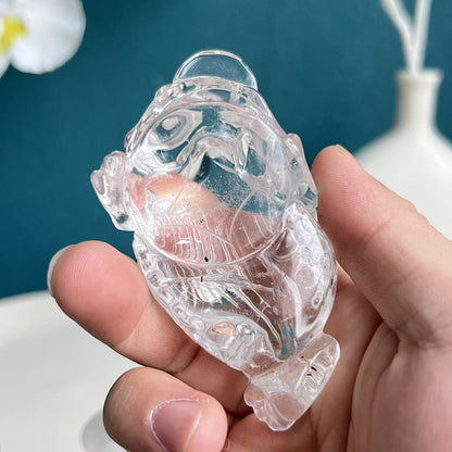 Clear quartz golden toad carving in recommended feng shui placement for wealth attraction