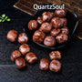 Natural Red Picture Jasper tumbled stones displayed in black bowl showing marbled pattern
