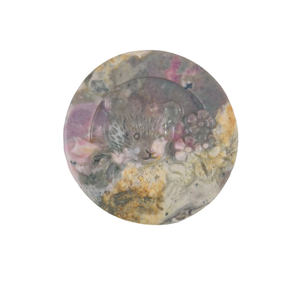 Color variation in natural rhodonite bear crystal carvings