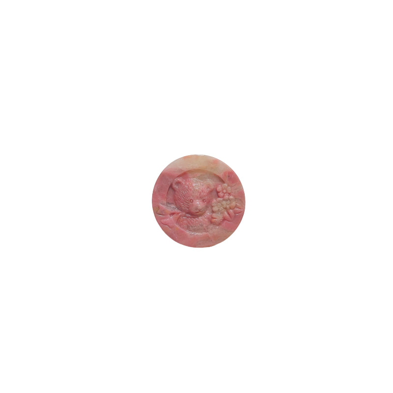 Front view of rhodonite bear carving showing detailed facial features