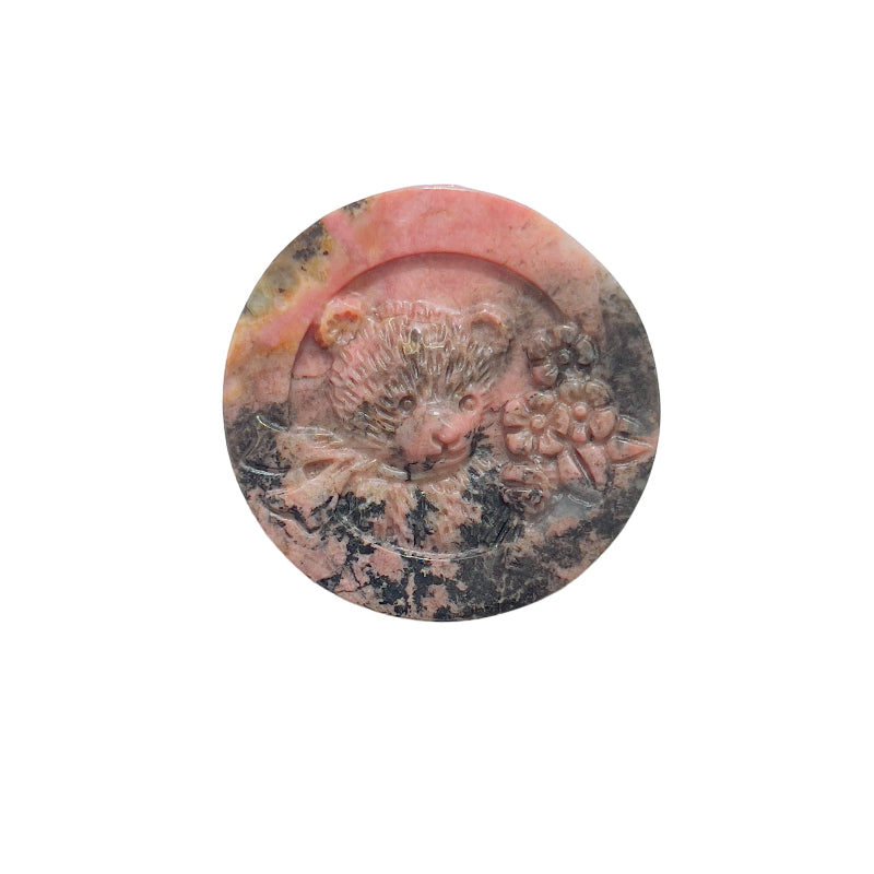 Natural color variations in rhodonite bear crystal carvings