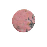 Black manganese oxide inclusions in rhodonite bear crystal carving