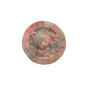 Rhodonite bear healing crystal displayed on wood stand
