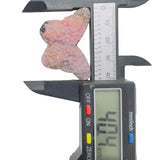 Close view of black manganese oxide inclusions in pink rhodonite butterfly carving
