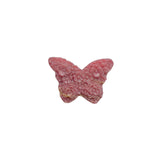 Rhodonite butterfly carving alongside crystal collection display