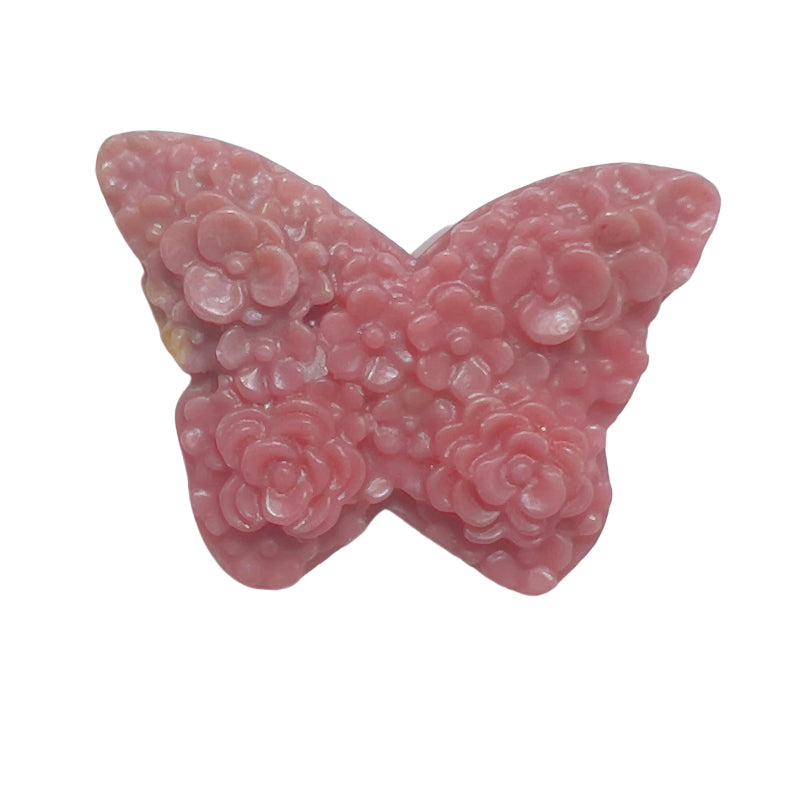 Close-up detail of intricate wing pattern on pink rhodonite butterfly carving