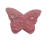 Close-up detail of intricate wing pattern on pink rhodonite butterfly carving