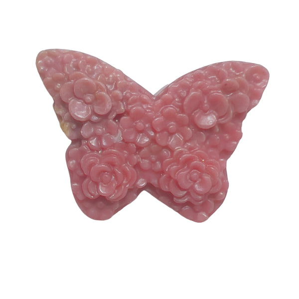 Close-up detail of intricate wing pattern on pink rhodonite butterfly carving
