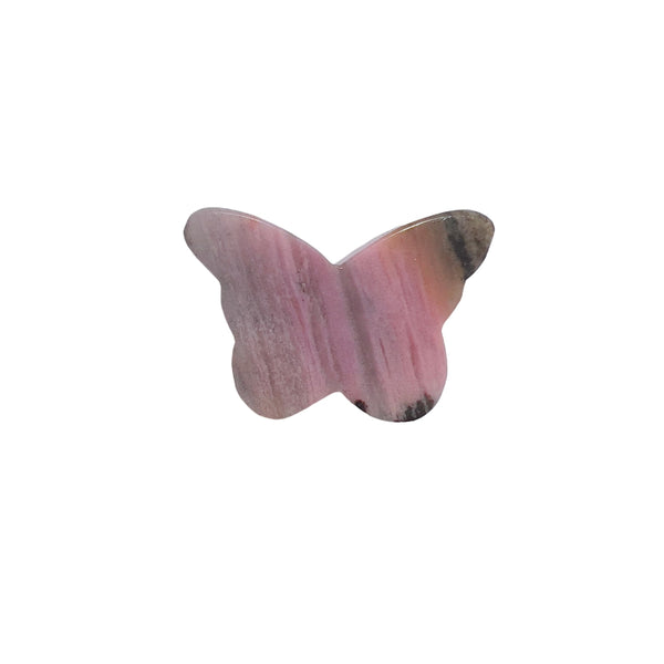 Rhodonite butterfly carving in meditation setting with complementary crystals
