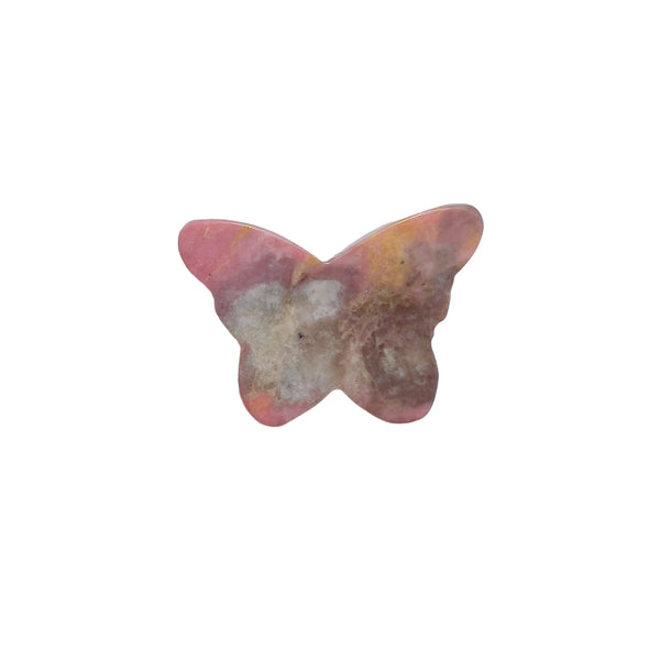 Rhodonite butterfly carving in meditation setup with complementary crystals