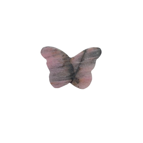 Side view of pink rhodonite butterfly crystal carving showing natural patterns