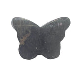 Rhodonite butterfly carving in crystal healing layout for heart chakra work