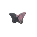Pink rhodonite butterfly carving showing natural veining patterns and polished surface