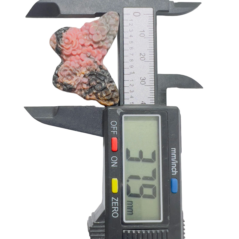  Side angle of rhodonite butterfly crystal showing natural pink and black veining pattern