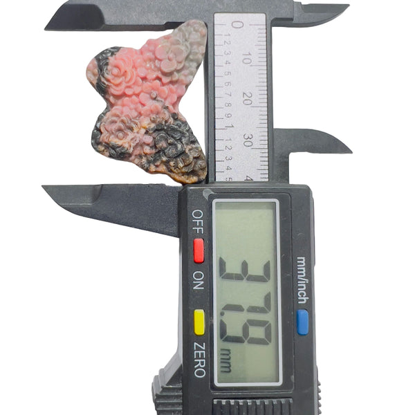  Side angle of rhodonite butterfly crystal showing natural pink and black veining pattern