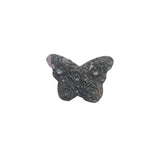 Rhodonite butterfly carving in peaceful meditation setting for emotional healing