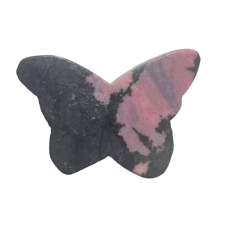 Close-up of rhodonite butterfly carving displaying natural pink color and black inclusions