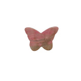 Rhodonite Butterfly Carving In Natural Light Showing Pink Coloration