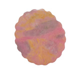 Back pattern of pink rhodonite crystal carving showing natural color variations
