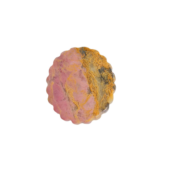 Rhodonite Crystal Carving In Natural Light Showing Color Variations