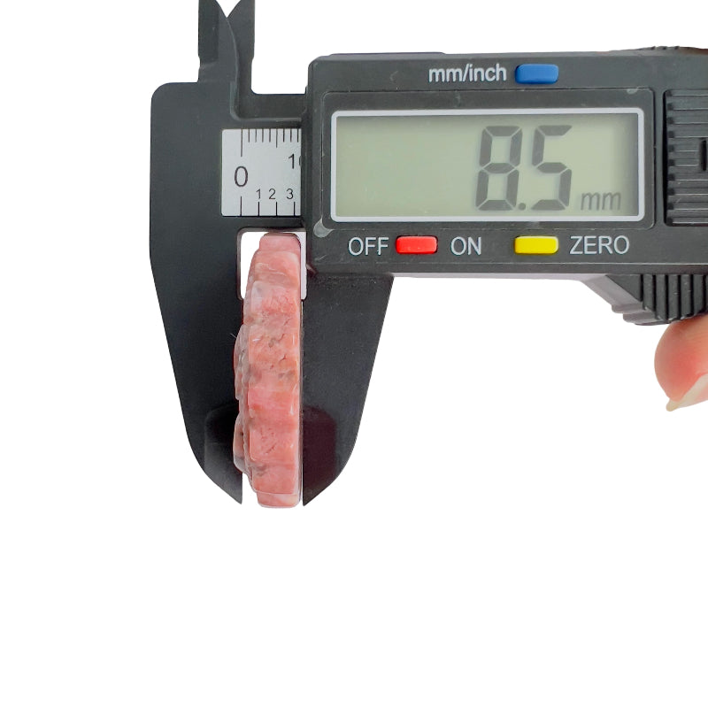 Pink rhodonite carved crystal thickness measurement