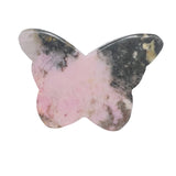 Extreme close-up of rhodonite butterfly wings showing craftsmanship detail