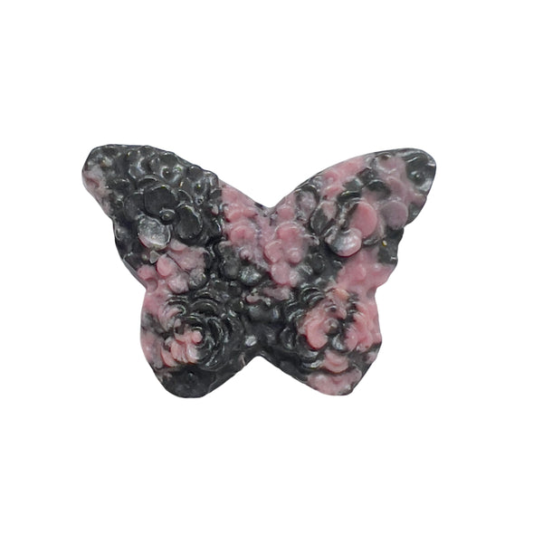 Palm-sized pink rhodonite butterfly carving highlighting the stone's natural beauty