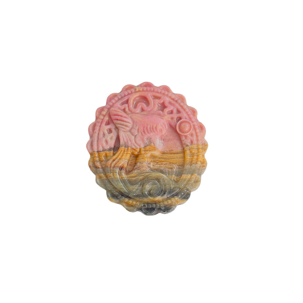 Light Reflecting off Polished Rhodonite Crystal Carving