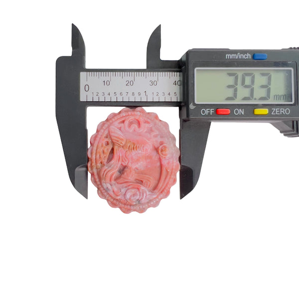Rhodonite carved crystal magical girl pattern shown in palm