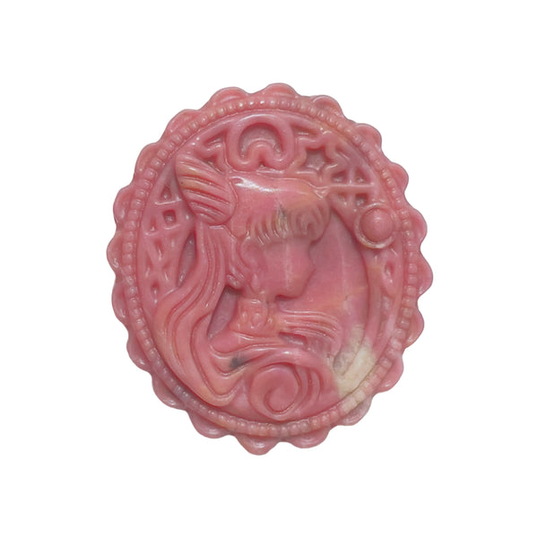 Backside of rhodonite crystal medallion showing textured grid pattern