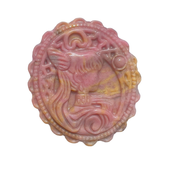 Close-up of rhodonite carved magical circular pattern with phoenix design