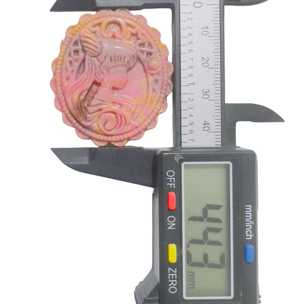 Rhodonite crystal pendant size measurement showing approximate diameter